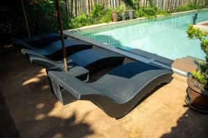 Poolside chaise lounges beside a Florida swimming pool