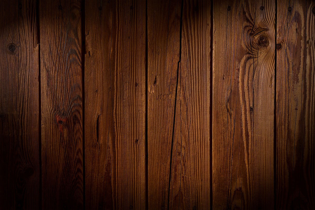 Close-up of HDPE recycled lumber outdoor dining table surface showing wood-grain texture on a Florida lanai