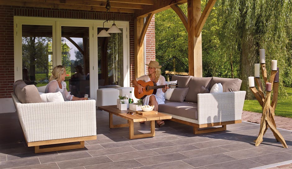 Long narrow screened Florida lanai with furniture arranged in two distinct zones
