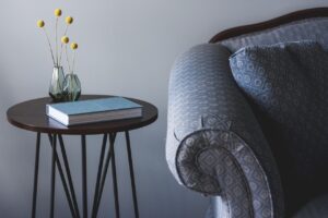 Outdoor reading chair and side table on a Florida screened lanai
