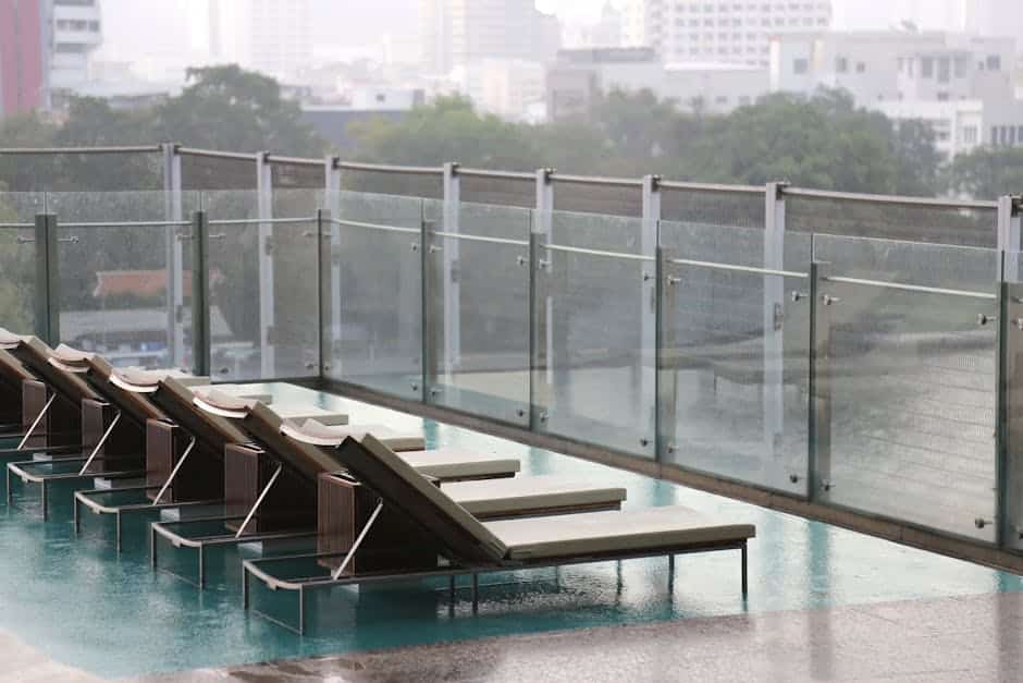 Powder-coated steel patio chair showing finish quality near a Florida pool