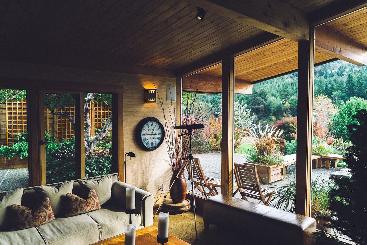 Sunbrella fabric outdoor cushions on aluminum patio chairs with a screened lanai in the background