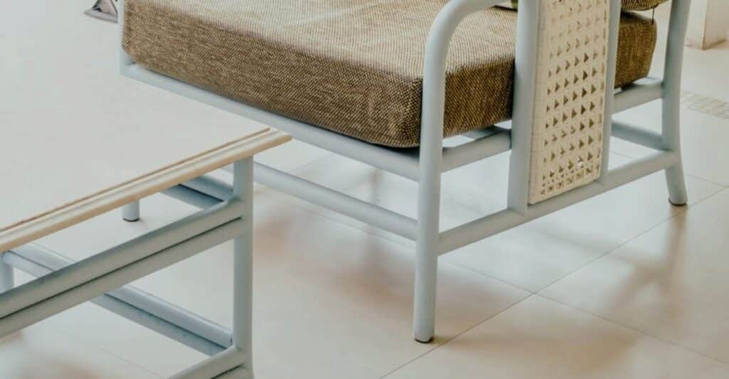 White PVC style furniture legs and table frame contact points on tile