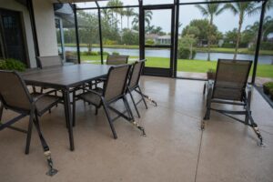 Patio furniture tied down with straps before a Florida hurricane