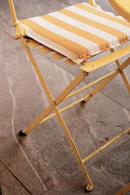 Aluminum glide rocker chair with Sunbrella cushion on a Florida lanai