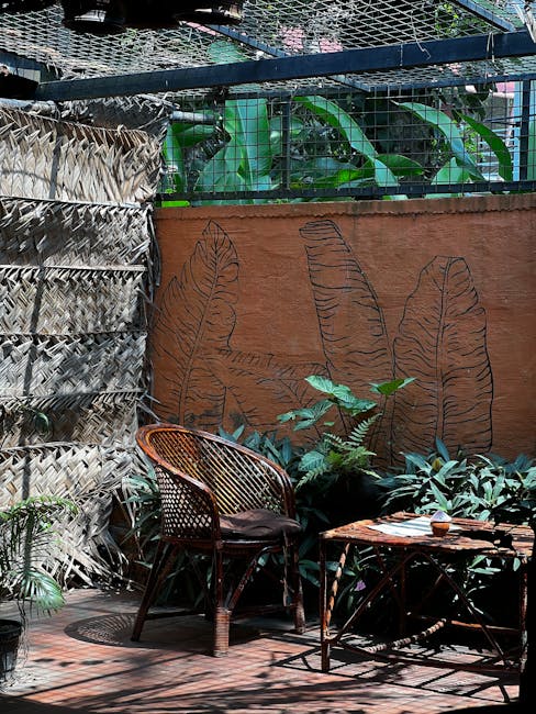 Bamboo and palm fiber patio decor on a screened Florida lanai surrounded by tropical plants