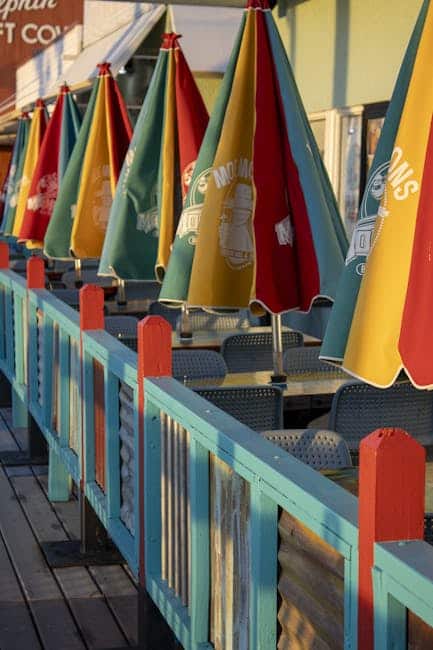 Sling chairs and HDPE side table with Sunbrella cushions on a Florida Gulf Coast dock