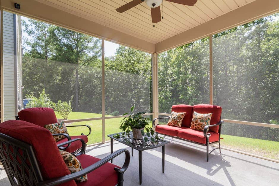 Wheelchair-accessible patio table setup on a Florida screened lanai with clear rolling path and proper seat heights