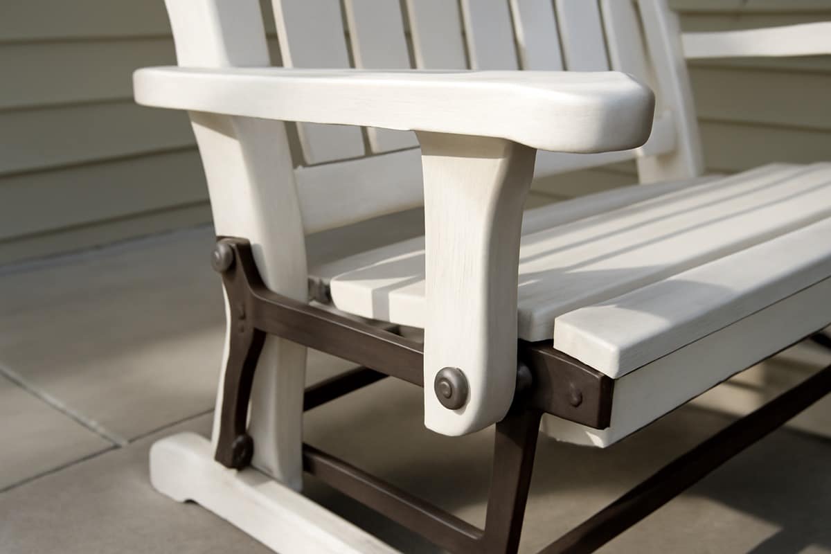 Aluminum adirondack chairs florida poolside compared with poly lumber chairs in a Gulf Coast backyard