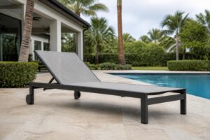 Wheeled outdoor chaise lounge on a paved patio