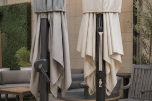 Patio umbrellas with crank and pulley lift hardware