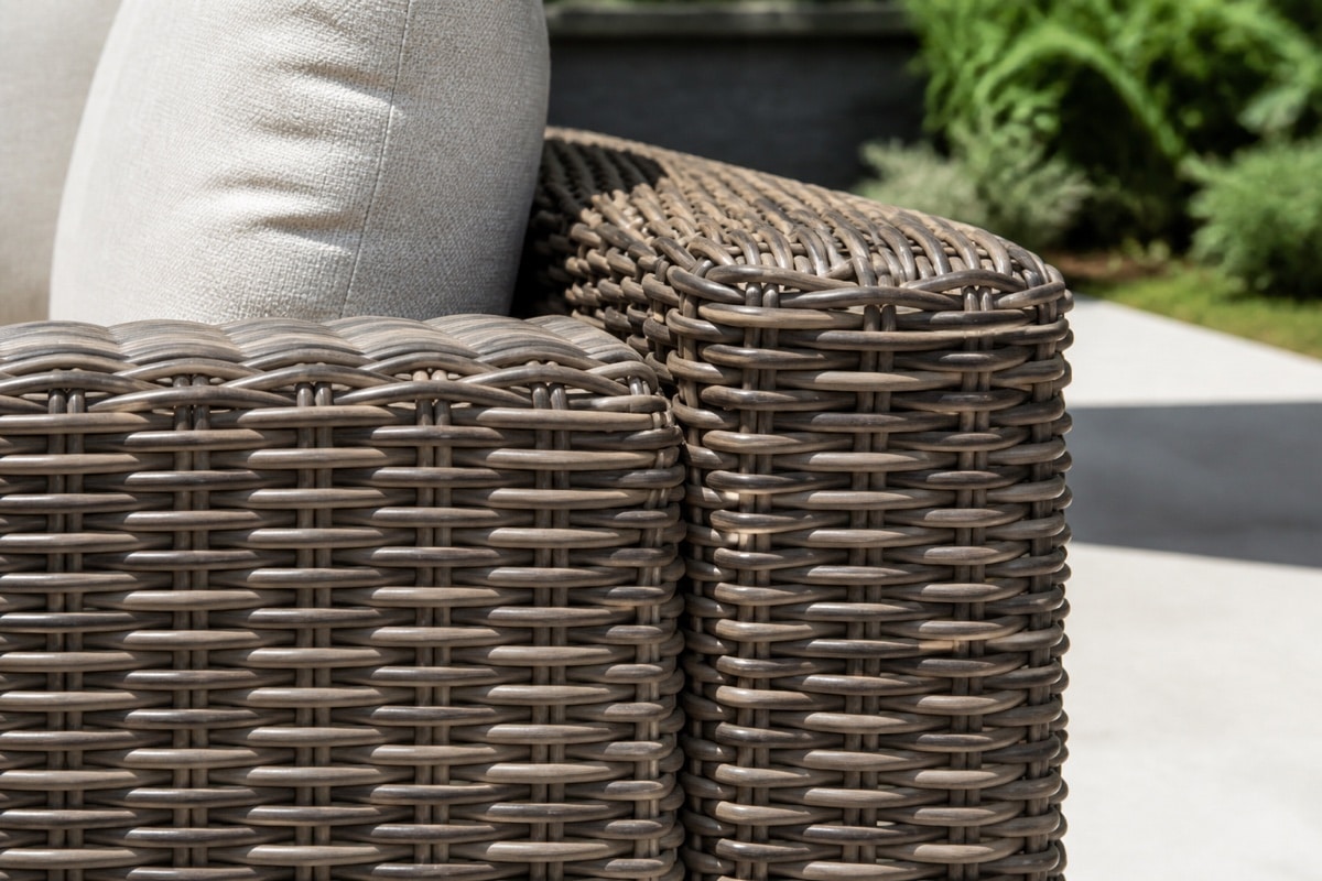 resin wicker outdoor sofa on a Florida lanai with cushions and woven side panels