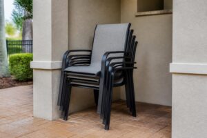 Stackable patio chairs arranged to show their storage footprint