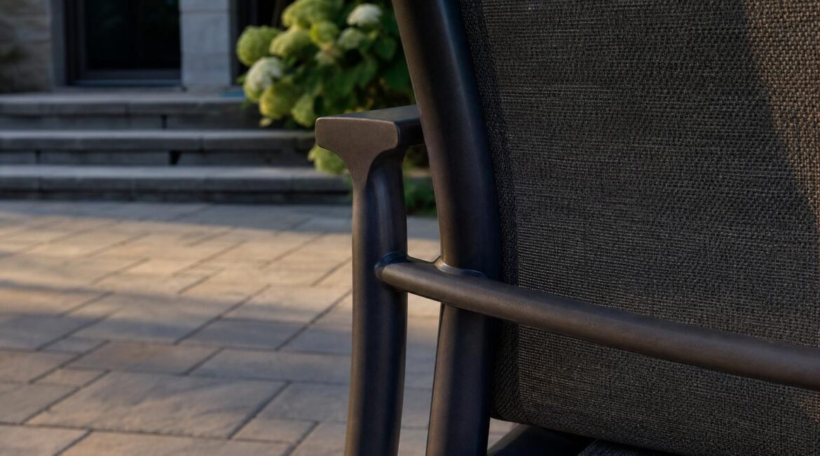 Aluminum patio dining chair frame where the arm meets the back leg