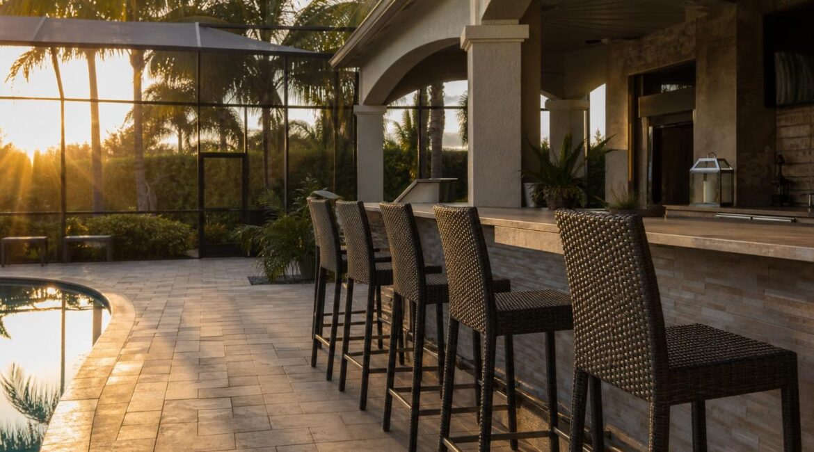 Featured wide shot of an outdoor patio bar with counter-height stools along the counter.