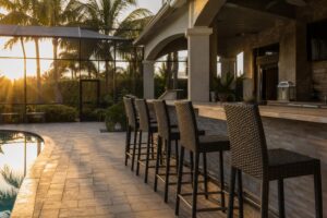 Featured wide shot of an outdoor patio bar with counter-height stools along the counter.