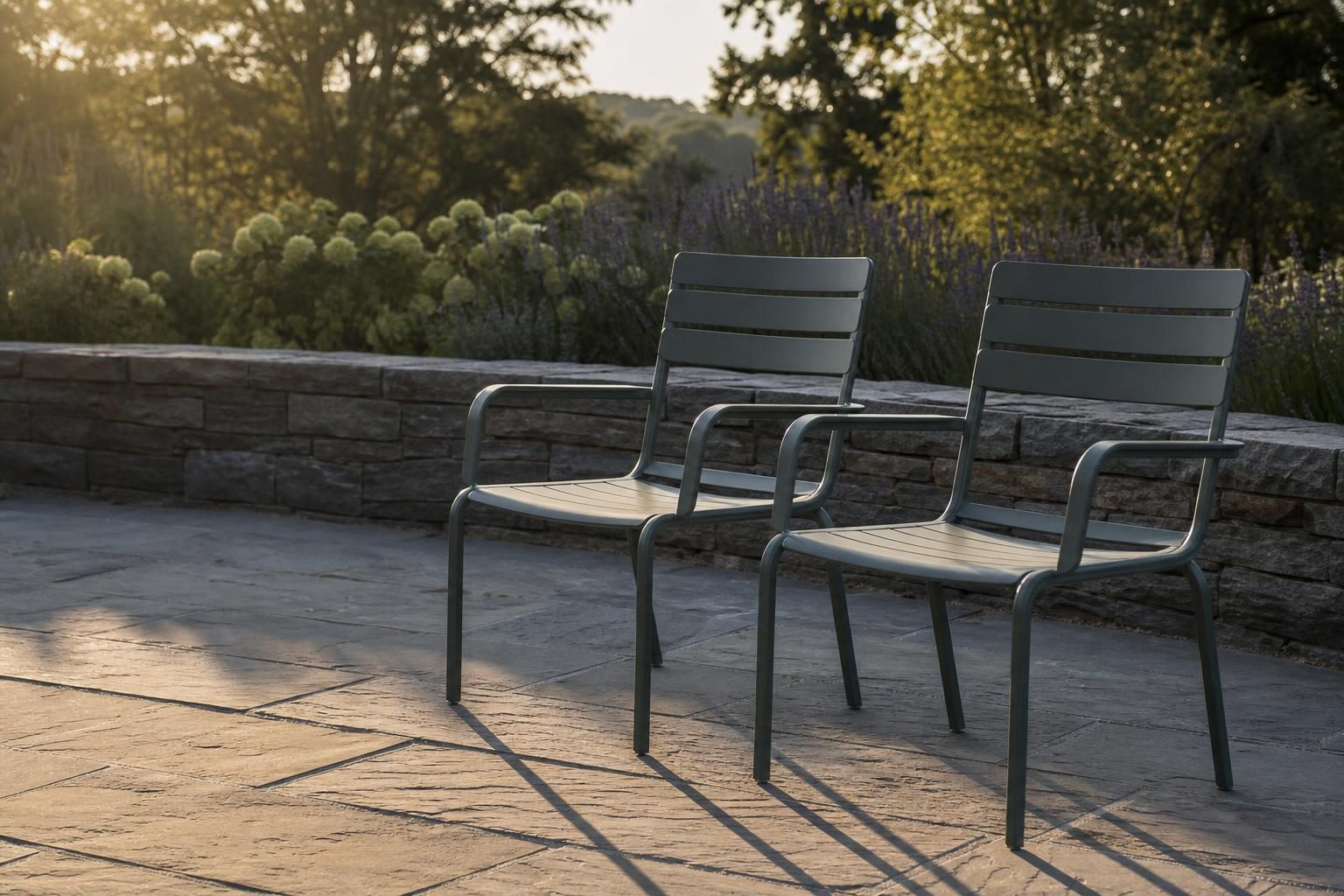 Two powder-coated aluminum patio chairs placed side by side outdoors, showing consistent finish color
