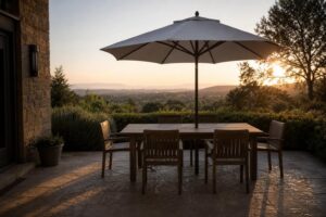 Featured wide shot of a patio dining table shaded by a large center-pole umbrella.